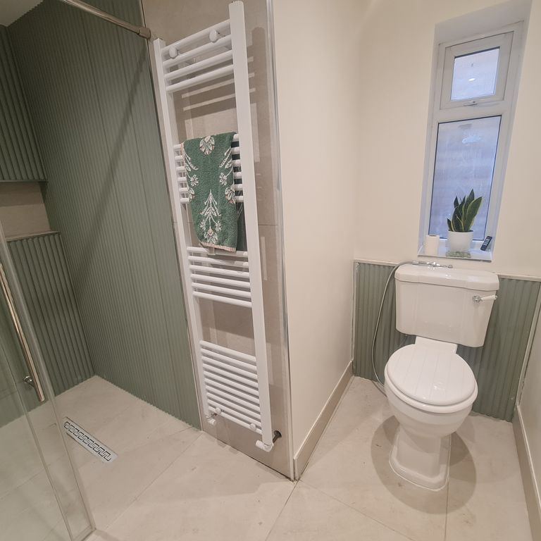 Completed Cardiff wet room toilet and towel radiator area by 1st Call Property Solutions